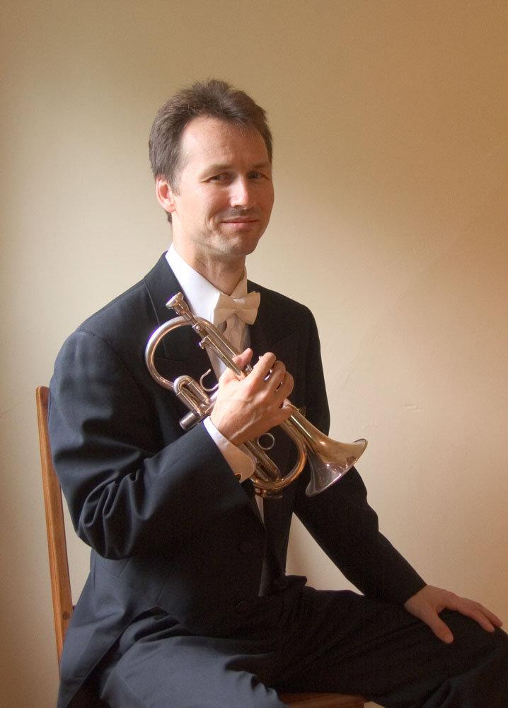 Norman Engel with trumpet, headshot